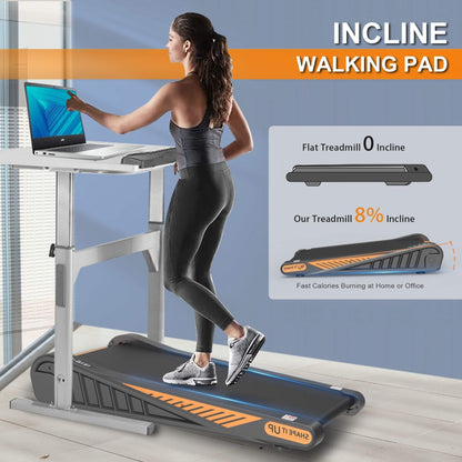 Woman using under desk walking pad while working from home