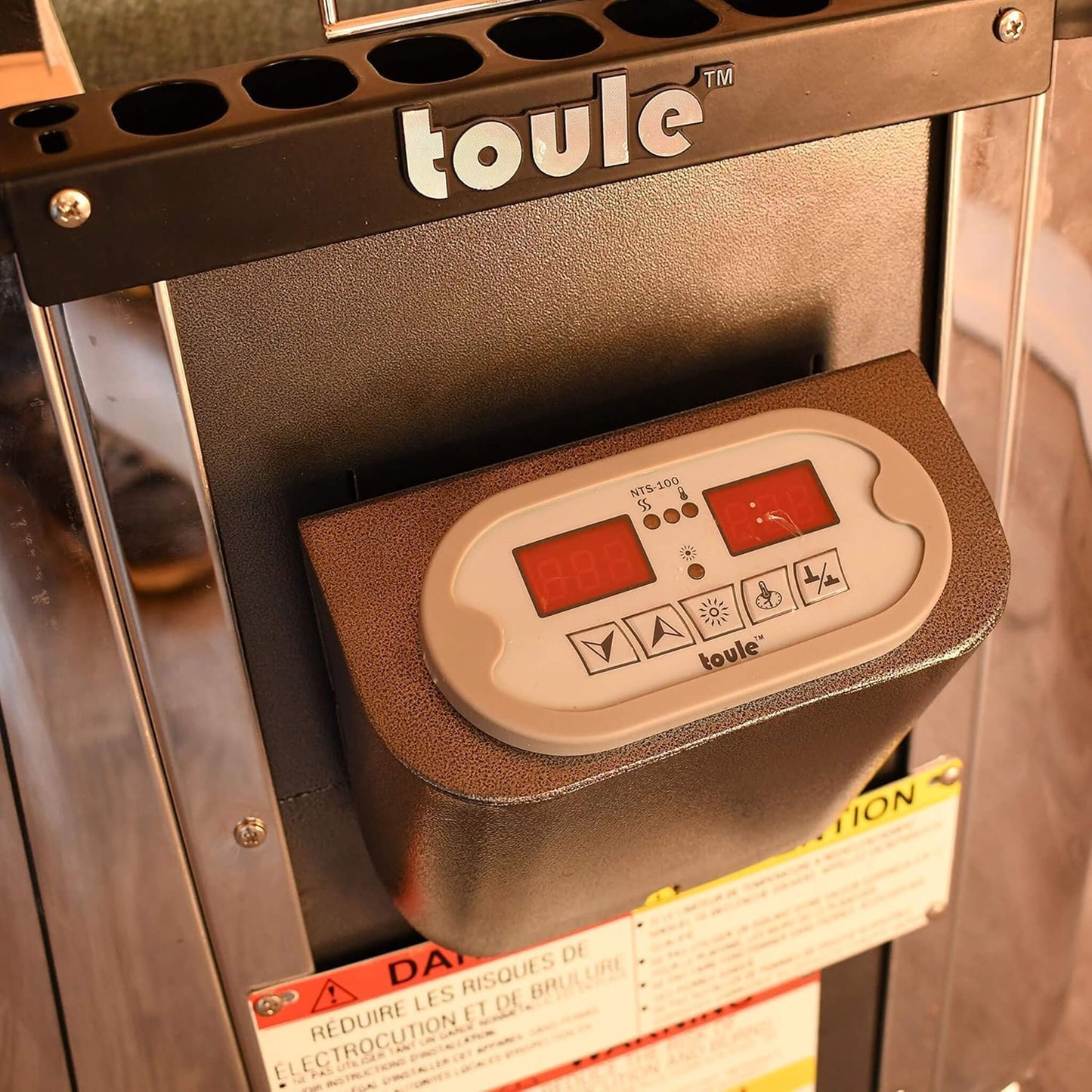 Toule product with digital display and control panel on a metallic surface